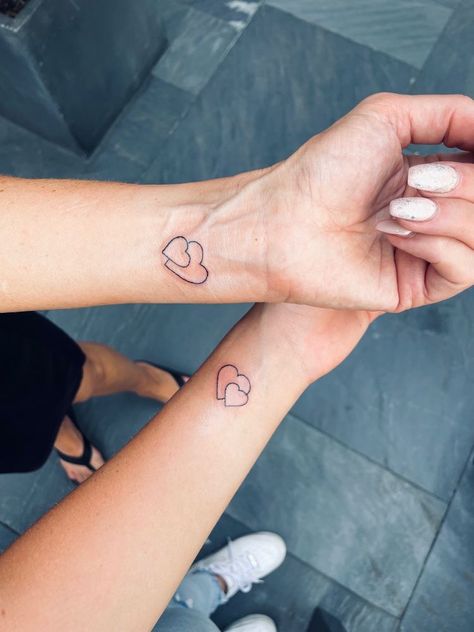 Small Tattoo For Mother And Daughter, Heart Tattoo For Mom And Daughters, Simplistic Mother Daughter Tattoo, Cute Small Mom And Daughter Tattoos, Heart Tattoo Mother Daughter, Matching Tattoos For Mum And 2 Daughters, Tattoo Idea For Mom And Daughter, Small Tattoos Mum And Daughter, Mother And Daughter Small Tattoos