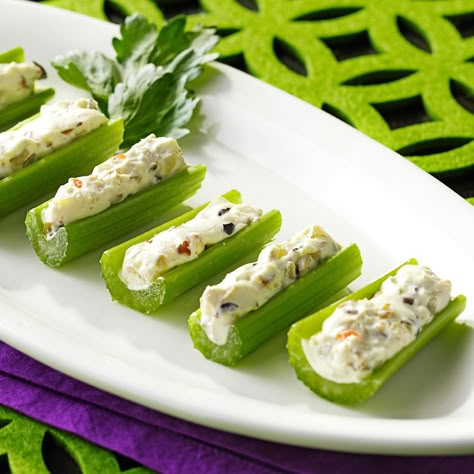 Olive-Stuffed Celery Recipe -My grandmother taught both me and my mom this appetizer recipes. We always serve at Christmas and Thanksgiving. The stuffing is so yummy that even if you don't normally care for the ingredients on their own, you'll love the end result.—Stacy Powell, Santa Fe, Texas Easy Cold Finger Foods, Stuffed Celery Sticks, Celery Recipe, Stuffed Celery, Cold Appetizers Easy, Cold Finger Foods, Cheese Mousse, Celery Recipes, Celery Sticks