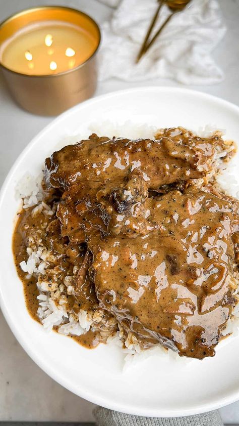 Smothered Steak and Gravy Roast And Rice And Gravy, Smother Steak, Baked Steak And Gravy, Smothered Steak And Gravy, Steak Over Rice, Tenderized Round Steak Recipes, Round Steak And Gravy, Smothered Round Steak, Smothered Cube Steak