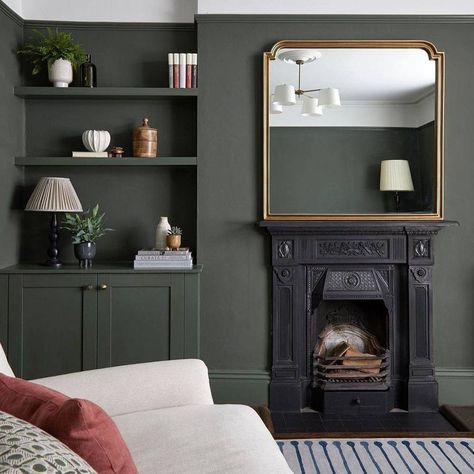 A dramatic olive green. Grounded and smokey, this green is perfect for interior and exterior colour schemes that need a botanical boost. Matt finish (2%) Durable & easy-clean Low odour & voc Easily hides imperfections Unrivalled coverage Do I need Primer? We recommend primer for any new wood, MDF, UPVC, Vinyl, or unstable looking surfaces. You’ll also need to mist-coat brand new plaster before adding your COAT colour. Olive Lounge Living Rooms, Coat Paint Brewer, Nomad Coat Paint, Coat Adulting Paint, Green Living Room Dark Wood, Green Fireplace And Built Ins, Lounge Diner Decor, Green Lounge Walls, Olive Green Study Room