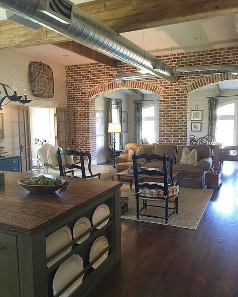 Barndominium Interior, Farmhouse Family Rooms, Industrial Farmhouse Decor, Exposed Brick Walls, Brick Walls, Industrial Farmhouse, High Ceilings, Wood Flooring, Exposed Brick