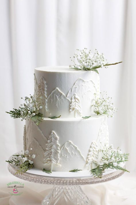 White Mountain Wedding Cake, Mountain Cake Wedding, Winter White Cake, Winter Wedding Cakes Rustic, Small Tier Wedding Cake, 2 Tier White Wedding Cake With Greenery, Ski Theme Wedding Cake, Wedding Cakes Christmas Theme, Woodsy Wedding Cake Ideas