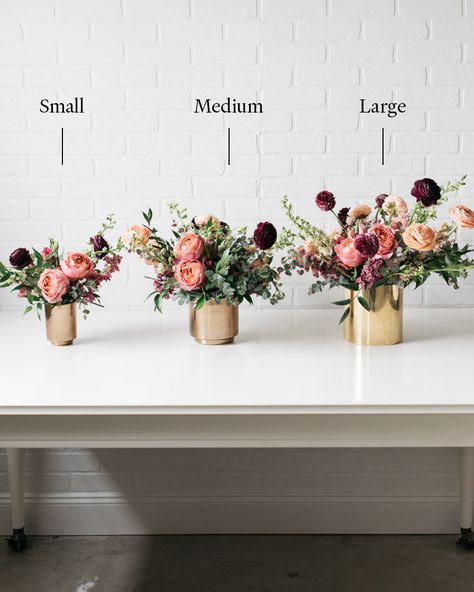 Freshest in the first 1-3 days. See Longevity Notes. Arrives arranged in vase with water. Features This item is a set. Here is what you will receive: - 2 large floral arrangements Bring your table to life with these large floral arrangements! This pair of bold and beautiful arrangements instantly transforms your table for any celebration. In bold shades of berry, blush and mauve with fresh garden roses and ranunculi, your guests will love them. This arrangement is Ready-To-Party™. Comes watered and arranged. Simply unbox and enjoy! * Designed with your event in mind, flowers are at their peak bloom on the day of your event. Longevity may vary based on temperature, environment and handling. Florals should avoid direct sunlight. Water daily to extend lifespan. Details Quantity:3 Medium arran Simply By Arrangement, Flower Decor Centerpiece, Birthday Arrangements Ideas, Table Decor Round Tables Wedding, Simple Arrangements Floral Design, Purple Flower Arrangements Vase, Simple Winter Floral Arrangements, Modern Centerpieces For Party, 1940s Flower Arrangements