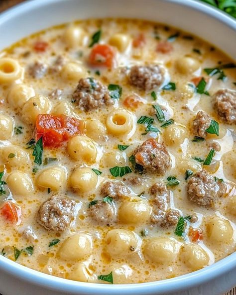 1 lb Italian sausage, casing removed 1 T olive oil 1 small onion, diced 2 cloves garlic, minced 14.5 oz can diced tomatoes, drained 4 cups chicken broth 1 cup heavy cream 1 cup small pasta (ditalini or elbow) 1 cup shredded Parmesan cheese 1/2 t dried basil 1/2 t dried oregano Salt and pepper Heat olive oil in pot. Add Italian sausage, breaking it up as it cooks until it is browned. Remove sausage from pot and set aside. In same pot, add onion & garlic. Cook 3–4 minutes. Stir in tomatoes, broth, basil, & oregano. Bring to boil. Add pasta to boiling broth mixture & cook until al dente. Reduce heat to medium-low. Stir in cream & cheese, allowing cheese to melt & thicken soup. Return cooked sausage to pot, stirring to combine. Season with salt & pepper. Ditalini Soup, Quick Soup Recipes, Quick Soup, Italian Sausage Soup, Quick And Easy Soup, Creamy Parmesan, Sausage Soup, Small Pasta, Pasta Soup