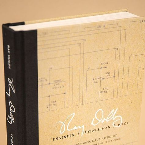 Edition One Books on Instagram: "This beautifully designed hardcover book recounts the life story of Ray Dolby (1933-2013), founder of @dolbylabs and the inventor of the noise reduction system Dolby NR. Offset printing on uncoated paper stock Smyth-sewn and glued binding Quarterbind cover – black linen spine with printed wrap panels White and black foil stamping on front cover, spine, back cover Endpapers printed 4/4 Bronze and white headbands 6" x 9" 312 pages . Design by Nicole Hayward nicolehayward.com / @nickyh2 . . . . #selfpublish #selfpublishing #bookmaking #bookbinding #custombooks #bookprinting #photographybook #photobook #bookdesign #artbookprinting #graphicdesign #professionalbooks #artistsbooks #gallerycatalogs #catalogprinting #softcover #hardcover #bookstagram #bookstagramm Rebound Book Covers, Hard Cover Book Binding, Debossed Book Cover, Exposed Spine Book Binding, Catalog Printing, Bookbinding Leather Cover, Custom Book, Self Publishing, Foil Stamping