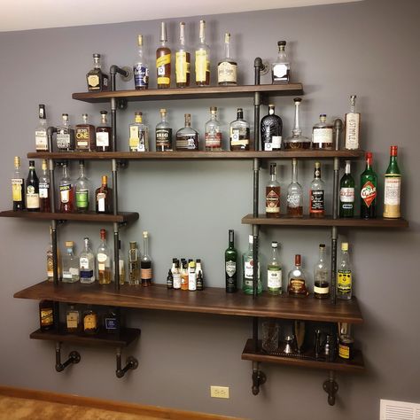 Mini Bar At Home Rustic, Pub Shelves Bar Ideas, Bourbon Man Cave Ideas, Cocktail Shelf Ideas, Wall Mount Bar Ideas, Wood Bar Shelving, Small Whisky Bar, Home Cocktail Station, Bar On Wall Ideas