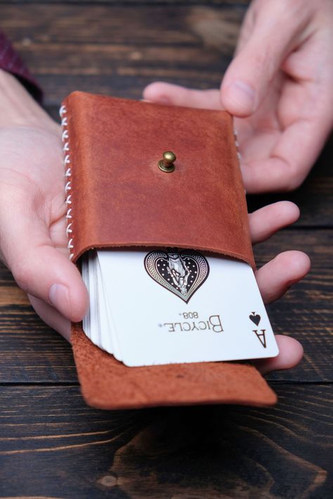 "A gorgeous gift for your loved one who loves to play cards. Genuine leather, it is always comfort and a chic look. Your deck of cards will be reliably protected! ♤ Handmade Personalized Playing Cards Holder. ♧ Perfect for poker decks or regular cards. ♢ Best gift for poker player. ♡ Helps to keep your cards in order. ♠️ Details: *100% handmade. *Durable full-grain leather. *Hand stitching with waxed thread. *Hight quality fittings. ♣️ Sizes: Length: 4,1in (10.5cm) Width: 3in (7.5cm) Height: 1in Art Du Cuir, Playing Card Case, Diy En Cuir, Leather Working Projects, Personalized Playing Cards, Leather Goodies, Playing Card Holder, Diy Leather Projects, Poker Card