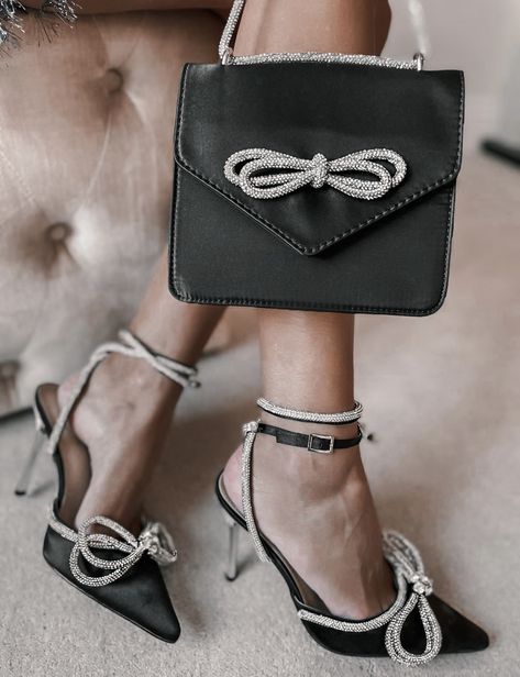 ASOS DESIGN envelope shoulder bag with diamante bow in black satin | Public Desire Wide Fit Midnight heeled shoes with bow detail in black Holiday Party Shoes, Design Envelope, Bow High Heels, Festival Shoes, Refined Fashion, Public Desire, Trending Sandals, Rhinestone Shoes, Latest Shoe Trends