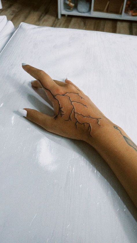 250+ Lightning Tattoos Ideas and Designs (2023) - TattoosBoyGirl Electricity Hand Tattoo, Lightening Hand Tattoos, Hand Tattoos Lightning Bolt, Hand Tattoos For Women Lightning, Lightning Tattoo Men Hand, Hand Lighting Tattoo, Lighting Tattoo Arm Sleeve, Lighting On Hand Tattoo, Lightning On Hand Tattoo