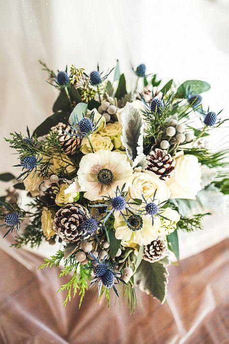 This bridal bouquet could be elegant for your winter wedding. Speaking from experience, this bouquet elevates a snowy backdrop. Pin this inspiration to your bridal floral collection. Green And Blue Winter Wedding, Winter Bridal Flowers, Winter Flower Bouquet, Snowy Backdrop, Winter Bridal Bouquets, Blue Winter Wedding, Green Wedding Bouquet, Winter Colours, Winter Wedding Bouquet