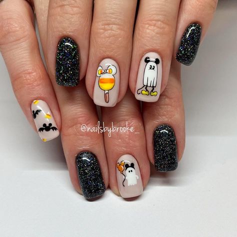 24+ Disney Halloween Nail Ideas You’ll Love For 2024 - DrExplains Cute Disney Halloween Nails, Lock Shock And Barrel Nails, Snoopy Halloween Nails, Disney Halloween Nail Art, Halloween Mickey Nails, Disney Movie Nails, Disney Fall Nails, Halloween Disney Nails, Fall Disney Nails