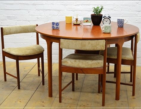 Mid century teak extending dining table + 4 tuck under chairs. Designed under danish influence and manufactured by McIntosh. Table is one solid & sturdy piece, that cannot be dismantled. Dimensions: Width: 121.8 cm, Height: 73.5 cm, Depth: 121.8 cm, Diameter: 121.8 cm. Date of manufacture: 1970s. Period: Mid 20th Century. Materials: Teak. Brand / Manufacturer: McIntosh. Place of origin: UK. Antique Dining Table And Chairs, Dining Table 4 Chairs, Antique Dining Table, Dining Tables And Chairs, Mid Century Dining Table, Dining Table 4, Antique Dining Tables, Midcentury Modern Dining Chairs, Dining Table And Chairs