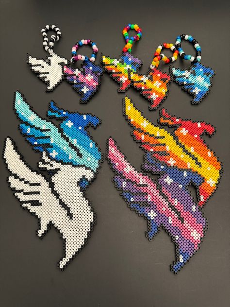 Handmade Illenium Inspired Kandi Perler Beads Art for Raves, Music Festivals. Choice of: Small bracelets. White, Fire, Galaxy or Ice larger Perler or necklace. More colors coming soon 🙂. Please note: the colors in the item may slightly change when made due to inventory. However, the overall item remains the same 😊. Rave Perler Bracelets, Illenium Perler Pattern, Illenium Perler, Rave Perler Ideas, Edm Perler, Rave Perler Pattern, Small Perler Bead Patterns, Perler Beads Art, Rave Perler