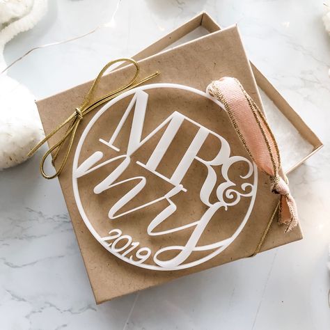 Mr & Mrs 2019 White Acrylic Ornament Is Perfect For Any Newlywed! The Ornaments Are 3.5" Diameter With Your Color Choice Of Beautiful Italian Ribbon For It To Hang From! These Make Great Gifts For Newly Married, Christmas, Bridal Showers, Tags, Etc. Each Ornament Is Packaged In A Kraft Box With Metallic Gold Bow Stretch Cord. Perfect For Gifting Upon Arrival! Acrylic Tree Ornaments, Acrylic Christmas Ornaments, Newlywed Christmas Ornament, Christmas Bridal Showers, Newlywed Christmas, Married Ornament, Diy Ornaments, Acrylic Keychains, Married Christmas