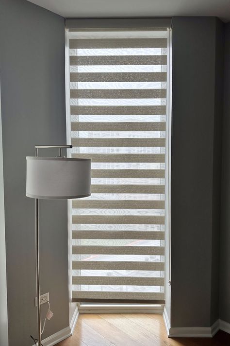 The layered shade’s sheer fabric protects furniture, flooring, and artwork from damaging UV rays, while the solid fabric stripes filter or block the light. Graber Blinds, Layered Shades, Pleated Shades, Chicago Downtown, Chicago Interior Design, Motorized Shades, Sheer Shades, Window Covering, Custom Drapery