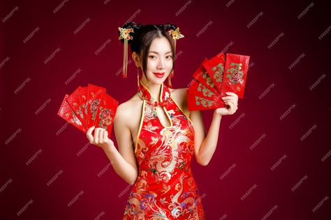 Premium Photo | Beautiful asian woman with clean fresh skin wearing traditional cheongsam dress holding red envelopes or ang pao on red background happy chinese new year chinese text means great luck great profit Red Cheongsam For Spring Festivals, Festive Fitted Red Cheongsam, Red Sleeveless Fitted Cheongsam, Red Fitted Summer Cheongsam, Elegant Red Sleeveless Cheongsam, Ang Pao, Fresh Skin, Cheongsam Dress, Happy Chinese New Year