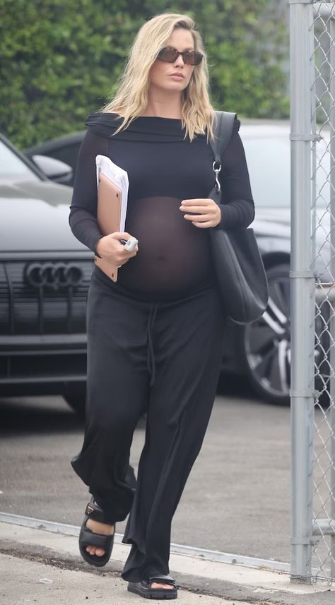 Margot Robbie's Sheer Top Remixes Maternity Wear For Millennials Margot Robbie Pregnant Outfits, Margot Robbie Pregnant 2024, Sheer Top Outfit, Pregnancy Fits, Tom Ackerley, Celebrity Maternity Style, Sheer Black Shirt, Lawyer Outfits, Charcoal Grey Dress