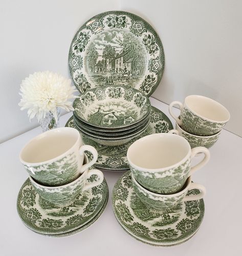 These beautiful vintage English Ironstone Tableware Ltd replacement pieces are white with green "Inn Series" country life transferware images. In good pre-owned condition except for one dinner plate which has a scratch, and one cup with marks on the inside (see photos). Pieces sold individually: 5x Soup Bowls 16cm dia. 3x Dinner Plates 24cm dia. 2x Side Plates 17.5cm dia. 5x Teacups 9cm dia. 6x Saucers 14cm dia. A lovely addition to any collection or perfect for adding a touch of retro elegance Green Vintage Dishes, English Country Tablescapes, Green Plates Dinnerware, Cute Dishware, Green Plates Table Setting, Green Tableware, Green Dishes, Green Transferware, Corningware Vintage