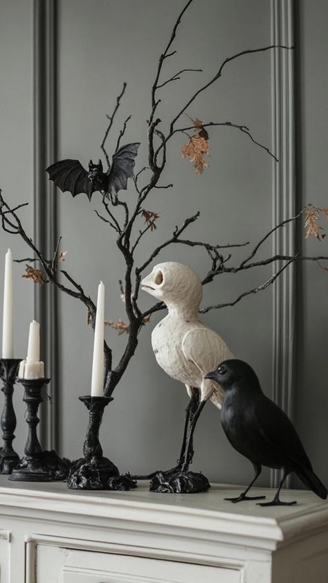 Transform your space with minimalist Halloween decor that's subtly spooky and effortlessly chic. Focus on negative space and strategic placement. Arrange a row of white pillar candles in varying heights on a sleek black tray. Display a single, oversized black pumpkin as a statement piece. Add intrigue with a few carefully placed vintage apothecary bottles. This restrained approach to Halloween decor creates an eerie ambiance that complements contemporary interiors. Minimalist Halloween Decor, Minimalist Halloween, Amazing Pumpkin Carving, Classy Halloween, Vintage Apothecary, Pumpkin Carving Designs, White Pillar Candles, Black Tray, Black Pumpkin