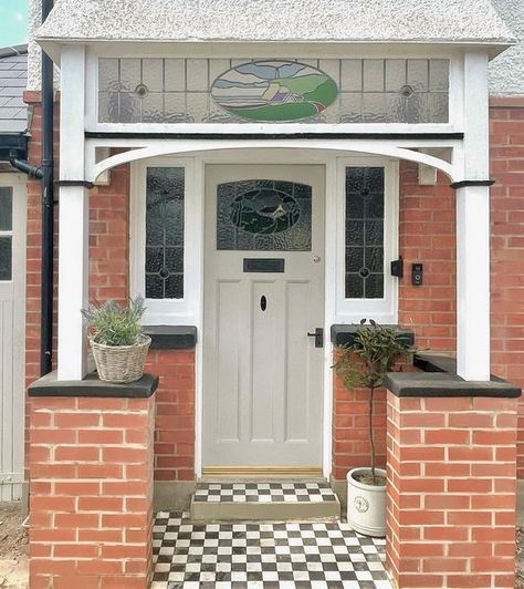 Gemma McCann on Instagram: "Front Door Glow Up ✨⁣⁣ ⁣⁣ Our driveway is a building site, and you can even see in the picture the amount of brick dust and sand over the porch and ground, BUT it’s all about progress, right?!⁣⁣ SWIPE to see the before.. ⁣⁣ But, here’s our front door now, it’s come a long way, (Ad| Pr) and made extra pretty curtesy of the gorgeous little wicker planter kindly gifted from @hortology 🤍⁣ ⁣ Front door painted- @farrowandball Purbeck Stone⁣ ⁣⁣ #frontdoorgoals #frontdoorso Front Door Top Window, 1920 Front Door, 1930 Front Door Porch, 1960 Front Door, 1930s Front Door With Side Panels, Uk Porch Ideas, Storm Porch, Bungalow Front Door, 1930s Front Door