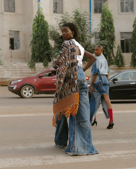 “Taking It To The Streets” with a selection of their best-selling pieces for their latest campaign, Nkwo Official ( @nkwo_official ) epitomizes their dedication to sustainable fashion and the celebration of African craftsmanship. Each garment intricately blends traditional textiles with contemporary aesthetics, meticulously handcrafted in Nigeria using locally sourced materials. With bold prints, exquisite detailing, and visionary silhouettes, their collections embody a profound commitment t... Shattered Reflection, Armor Skirt, Afro Punk Outfits, Sustainable Fashion Upcycling, Nigeria Fashion, Nomad Fashion, Unique Fashion Outfits, Denim Aesthetic, Bling Denim