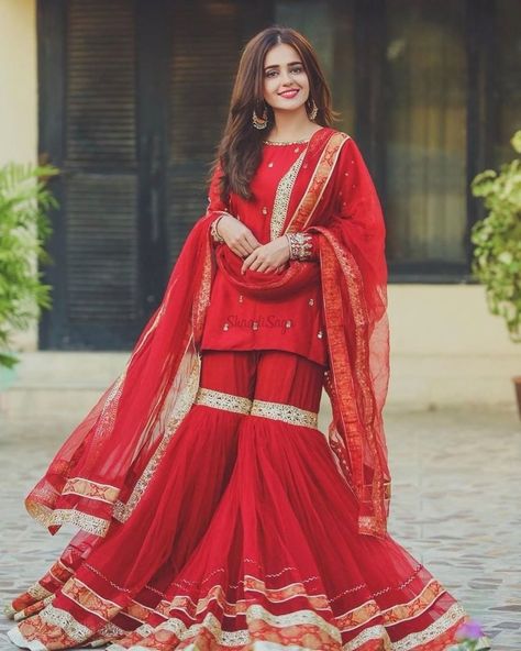 Check out our blog to find 45+ Bridesmaids Outfits/Bride's Sister outfits. we have got beautiul outfits from Suits to Sarees #shaadisaga #indianwedding #bridessisteroutfits #bridessisteroutfitsindian #bridessisteroutfitsideas #lehengaforbridessister #bridessisteroutfitforengagement #bridesisteroutfitsaree #bridesmaidoutfits #bridesmaidoutfitindian #haldibridesmaidoutfits #punjabibridesmaidsoutfits #bridemaidsoutfitsideas #sarees #lehengas #sharara #suits Asian Attire, Gharara Designs, Sharara Designs, Marriage Ideas, Hand Jewellery, Punjabi Salwar, Pakistani Celebrities, Pakistani Wedding Outfits, Pakistani Dresses Casual