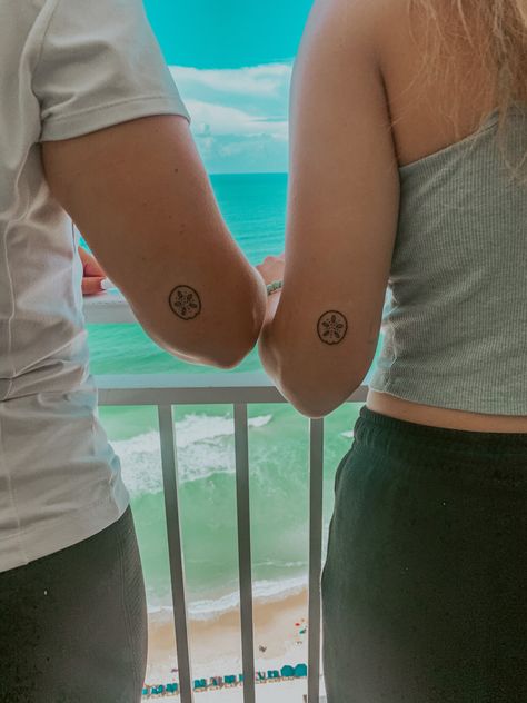 Sanddollar Tattoo Simple, Best Friend Sea Shell Tattoo, Sand Dollar Fine Line Tattoo, Island Vibe Tattoo, Beach Best Friend Tattoos, Tiny Sand Dollar Tattoo, Sand Dollar Tattoo For Women, Simple Sand Dollar Tattoo, Beachy Matching Tattoos