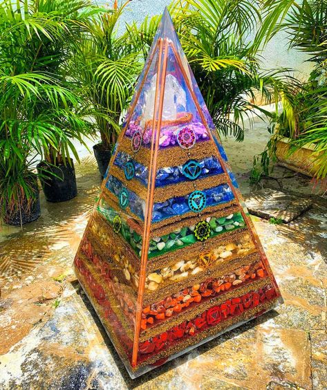 How beautiful is this orgonite pyramid! 😍  The energy from orgonites is known as universal energy, and properties of crystals in orgonites are amplified. These pyramids are also a powerful tool used to cleanse stagnant and negative energies. 💫 credit: @darlanloureiro Crystal Room Decor, Resin Pyramid, Crystal Room, Real Crystals, Wholesale Crystals, Orgonite Pyramids, Spiritual Crystals, Resin Design, Resin Artwork