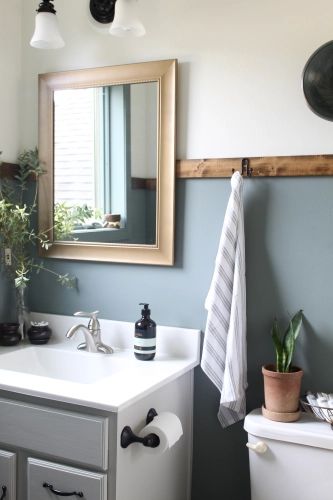 A $0 Bathroom Makeover  Transformation! Basement Bathroom Paint Ideas, Industrial Bathroom Paint Colors, Colored Trim Bathroom, Small Bathroom Repaint, Bathroom Color For Small Bathroom, Blue Wall Bathroom Ideas Paint, Bathroom Decor Dark Blue, Dual Color Bathroom Walls, Blue Bathroom Board And Batten