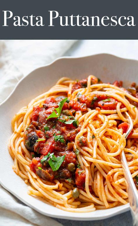 Pasta Puttanesca is a classic Italian pasta dish that's ready in under 40 minutes! Make it with canned tomato paste and crushed tomatoes, canned anchovies, jarred olives and capers. So simple and so good. #pasta #puttanesca #italianfood #italianrecipes #spaghettirecipes #simplyrecipes #easydinner #weeknightdinner Canned Tomato Paste, Pasta Puttanesca Recipe, Good Pasta, Classic Italian Pasta, Baked Fish Fillet, Pasta Puttanesca, Dinner Pasta, Italian Pasta Dishes, Yummy Pasta Recipes