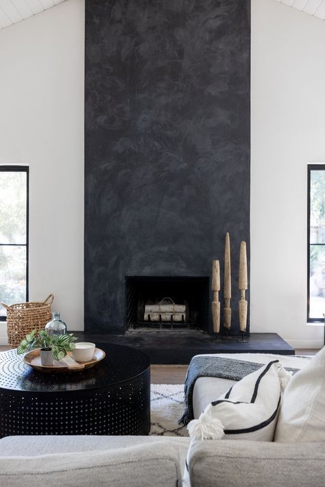 Black Concrete Fireplace Surround, Limewash Black Fireplace, Dark Stucco Fireplace, Black Painted Fireplace Wall, Black Metal Fireplace Surround, Cement Looking Fireplace, Dark Concrete Fireplace, Dark Limewash Fireplace, Grey Plaster Fireplace