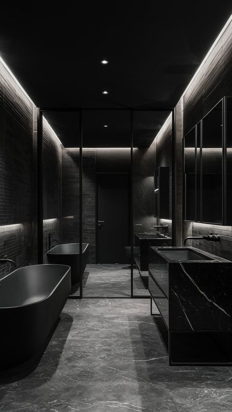 Discover the allure of an elegantly designed bathroom that exudes sophistication and tranquility. With its sleek matte black finishes, this luxurious space combines modern aesthetics with a timeless charm. From the stunning fixtures to the soft ambient lighting, every detail is meticulously crafted to transform your daily routine into a spa-like experience. Get inspired to create your own oasis of relaxation and style! ✨🖤 Luxurious Black Bathroom, Black Houses Interior, All Black House Interiors, All Black Home, All Black Houses, Villains Lair, All Black Interior, Lighting Bathroom Vanity, All Black Bathroom