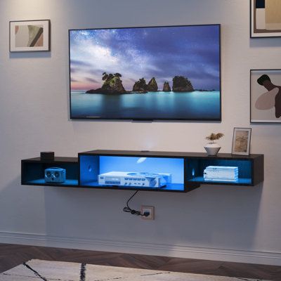 The floating TV shelf with LED lights provides cool and elegant blue lighting. With cool lighting, this wall mounted TV stand will bring better entertainment experience for your family to watch movies and play games. This space-saving floating entertainment center is perfect for living rooms and bedrooms. This wall mounted TV stand with power outlet and 79" supply cord is very convenient, which is perfect for your TV, DVD, WiFi router, mobile phone , tablet computer, etc. Recessed power strips a Wall Mount Entertainment Center, Tv Media Console, Floating Tv Shelf, Wall Mount Tv Stand, Floating Entertainment Center, Under Tv, Led Tv Stand, Floating Tv Stand, Floating Tv