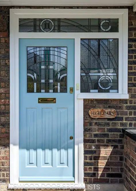 Art Deco front entrance. 1930s front door fitted in london with geometric Jean Dunand inspired stained glass. Glass uses lots of different textures with some flashes of coloured teal glass. The glass has a number above the door in coloured glass. Door is painted light blue with a white door frame. Door is fitted in a london brick home and has polished brass door furniture. Art Deco Front Door Entrance, White Door Frame, Light Blue Door, Art Deco Front Door, 1930s Doors, Jean Dunand, 1930s Design, Front Doors Uk, Victorian Doors