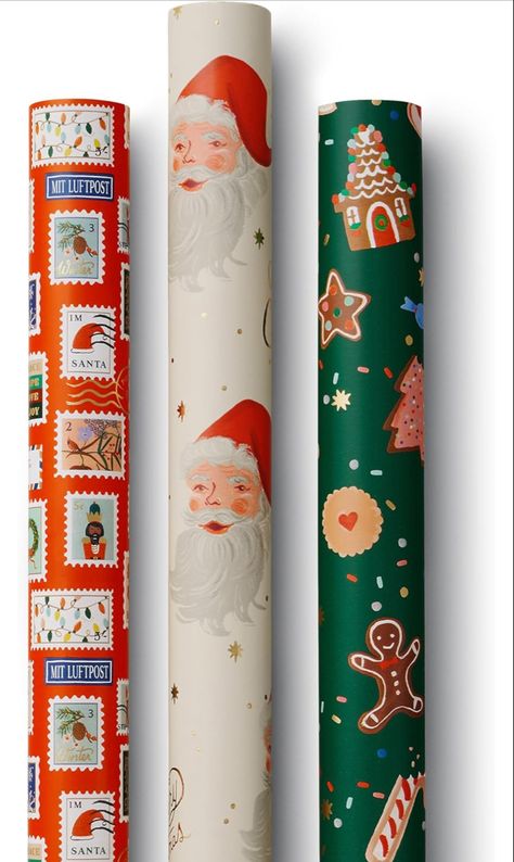 Three rolls of wrapping paper, each either a different theme. Dove Christmas Card, Holiday Bouquet, Christmas Tree Advent Calendar, Gift Wrapping Station, Wrapping Station, Santa Christmas Cards, Wine Gift Bag, Holiday Stamping, Holiday Bows