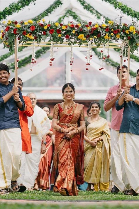 Simple south Indian bridal entry! We love a good bridal entry! It not only sets up the stage for a beautiful wedding day but also is a great way for the bridal reveal. This is one walk down the mandap or aisle that you will remember for a lifetime. So how do you make it one of a kind? We’ve done your homework for you and rounded up the most unique ideas that we loved for a bridal entry. Read on and bookmark your favourite one now! Unique Bridal Entry, Indian Bridal Entry, Bridal Entry Ideas, Malayali Bride, Indian Wedding Aesthetic, Indian Wedding Stage, Bridal Entry, Bride Entry, Indian Marriage