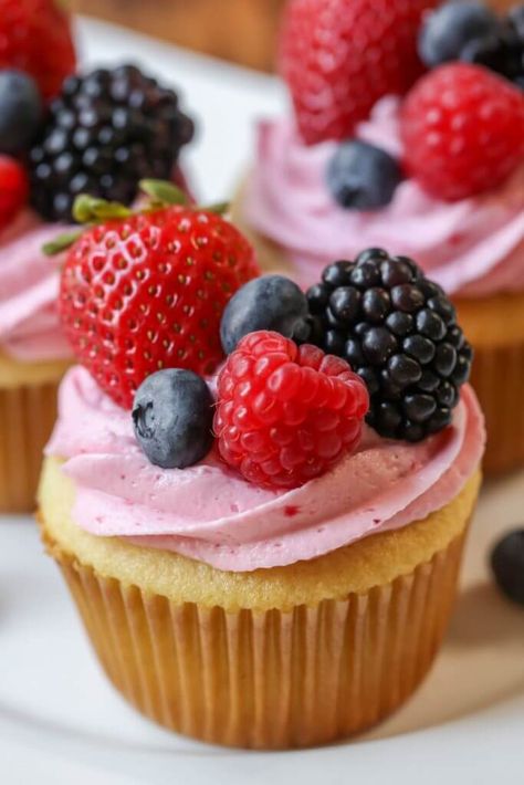 Vanilla Cupcakes with a delicious homemade berry buttercream frosting made with strawberries, blueberries, raspberries and blackberries. Berry Cupcake Recipes, Berry Buttercream, Fruity Cupcakes, Twotti Fruity, Berry Cupcakes, Frosting Tips, Buttercream Frosting Recipe, Mini Cheesecakes, Vanilla Cupcakes