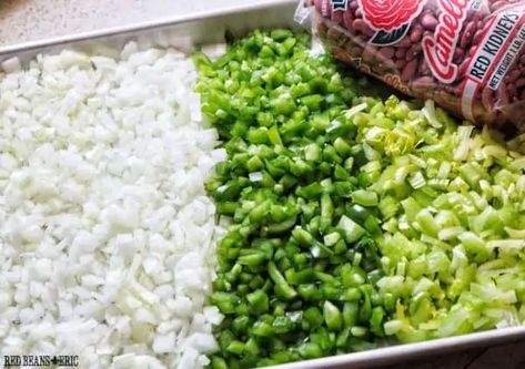 The start of many Creole and Cajun dishes calls for the Holy Trinity. This seasoning base is the Louisiana version of the traditional mirepoix and is a combination of three aromatic ingredients: onions, bell pepper, and celery. Cajun Trinity Recipe, Green Sauces, Cajun Trinity, Pickled Peaches, Okra Gumbo, Red Beans And Rice Recipe, Red Beans N Rice Recipe, Sauteed Cabbage, Louisiana Travel