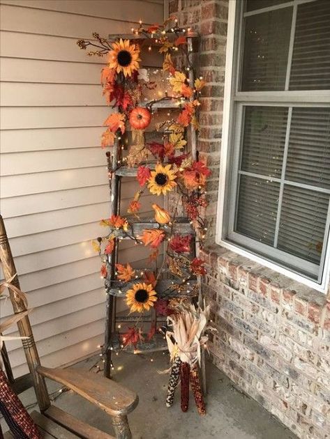 65+ Amazing Thanksgiving Porch Decorations for a Happy Fall | HubPages Wooden Ladder Fall Decor, Outdoor Fall Ladder Decor, Fall Ladders Ideas, Fall Ladder Decor Ideas Outdoor, Decorating A Ladder For Fall, Fall Porch Ladder Decor, Ladder Halloween Decor, Outdoor Seasonal Decor, Fall Decor With Ladders