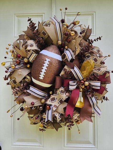 This Football Wreath will look amazing hanging on your door or on your wall! This Grapevine Wreath will be a perfect gift for someone or even a special treat to yourself! Just imagine how many of your guests will be in awe of this Football Wreath. Best places to be used: It is weather resistant outdoors but please move inside in extreme weather conditions. Colors: Brown, White and Burgundy If this one of a kind Football Wreath isn't the perfect fit check out the other related products in my shop Diy Football Wreaths For Front Door, Football Themed Wreaths, Cleveland Browns Wreath, Cute Wreaths, Football Wreaths For Front Door, Fall Grapevine Wreath Ideas, Dollar Tree Wreath Ideas, Thanksgiving Wreaths For Front Door, Football Wreath Diy