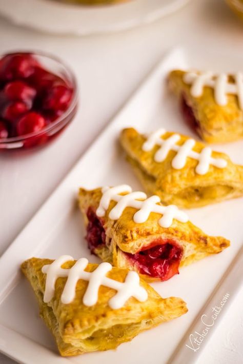 Game Day Mini Turnovers: a perfect Superbowl dessert | Kitchen Cents Nutella Puff Pastry Football, Corn Puffs White Chocolate, Football Shaped Puff Pastry, Mini Chicken Pies Puff Pastries, Superbowl Party Desserts, Puff Pastry Pecan Pie Bites Food Dolls, Cherry Pie Filling Recipes, Superbowl Desserts, Lemon Cheesecake Bars