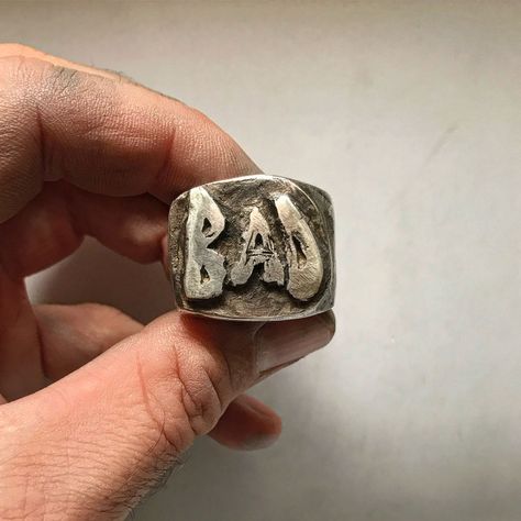 It’s a statement ring bursting with attitude. Made of solid Sterling silver, our BAD ring is large, with a thick band that demands... Cowboy Ring, Strange Rings, Thick Rings, Vintage Jewelry Rings, Tooth Ring, Metal Smithing, Biker Jewelry, Ceramic Ring, Ring Mens