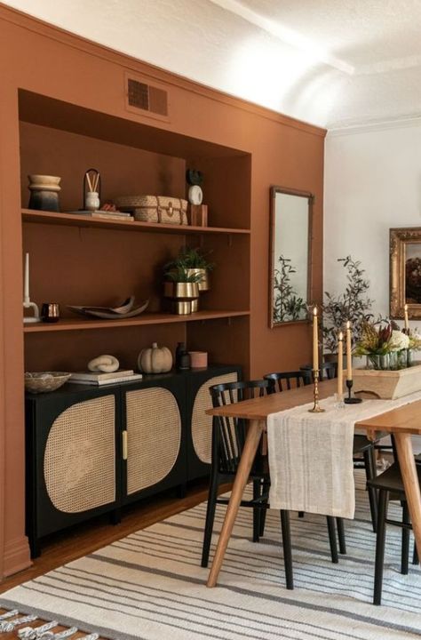 Orange Wall Dining Room, Terracotta Accent Wall Dining Room, Living Dining Room Paint Color Ideas, Terracotta Walls Dining Room, Cognac Accent Wall, Desert Inspired Dining Room, Painted Accent Wall Dining Room, Dark Orange Dining Room, Terracotta Accent Wall Kitchen