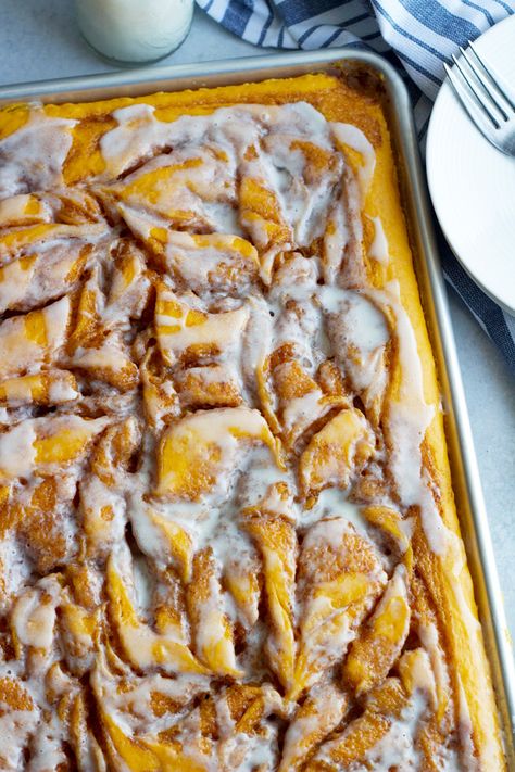 This Cinnamon Roll Pumpkin Sheet Cake is going to knock your socks off! Swirls of cinnamon and vanilla glaze . . .its absolutely incredible! It's the perfect holiday dessert. Cinnamon Roll Pumpkin Cake, Cinnamon Roll Pumpkin Dessert, Pumpkin Cinnamon Roll Cake, Pumpkin Coffee Sheet Cake, Pumpkin Pie Cinnamon Roll Bake, Crockpot Pumpkin Cinnamon Roll Casserole, Cinnamon Swirl Sheet Pan Pancakes, Pumpkin French Toast Casserole, Pumpkin Dump Cake Recipe