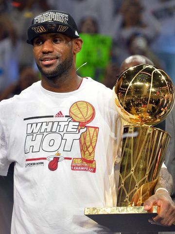 Miami Heat small forward LeBron James holds the MVP trophy and the Larry O'Brien Championship trophy after defeating the San Antonio Spurs in game seven in the 2013 NBA Finals at American Airlines Arena. Miami Heat won 95-88 to win the NBA Championship. Lebron James Dwyane Wade, Nba Superstars, Mvp Trophy, Heat Basketball, King Lebron, Nba Championship, Small Forward, Lebron Shoes, Nba Sports