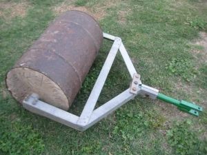 Lawn Roller - Homemade lawn roller constructed from a surplus steel drum, concrete, angle iron, and pipe. Garden Shed Storage Ideas, Garden Shed Storage, Shed Storage Ideas, Garden Tractor Attachments, Lawn Roller, Atv Implements, Lawn Rollers, Garden Tool Holder, Homemade Tractor