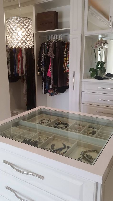 A see through center island counter top, allowing you to view your precious jewelry at a glance.    Designed by Senior Designer Jeanne Hessen  Learn more: https://www.closetfactory.com/custom-closets/ Closet Island Jewelry Drawers, Closet Island Glass Top, Center Closet Island, Walk In Closet Center Island, Glass Top Jewelry Drawer, Closet Island With Jewelry Storage, Closet Island With Glass Top, Jewelry Island In Closet, Closet Center Island