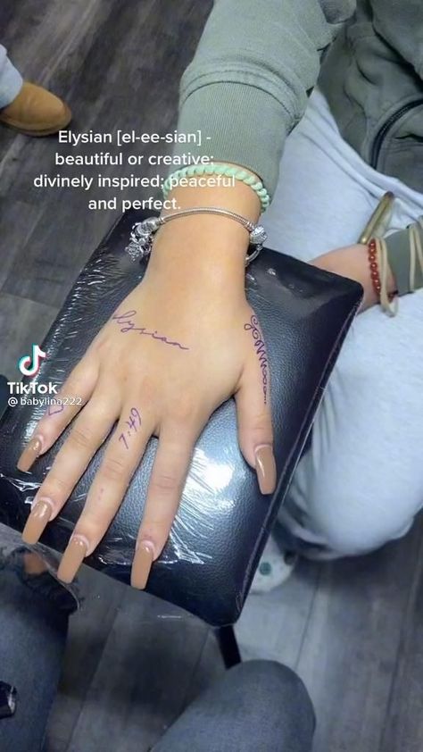 Single Word Hand Tattoos, Tattoo Dots On Fingers Meaning, Script Hand Tattoos For Women, Creative Word Tattoos, Outer Hand Tattoo, Word Hand Tattoos For Women, Hand Tattoos Writing, Small Writing Tattoo, Thumb Tattoos For Women