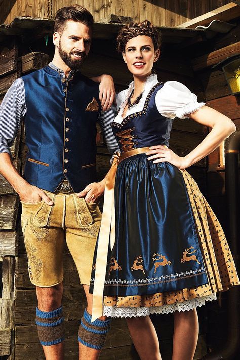 These are traditional German/Oktoberfest attire: Liederhosen for men, and Dirndls for women. Many people at Oktoberfests today will dress up in this type of clothing since it was such a valued tradition in the past. Oktoberfest Attire, Austrian Clothes, German Traditional Clothing, Traditional German Clothing, German Traditional Dress, Germany Outfits, Oktoberfest Outfits, German Clothing, German Outfit