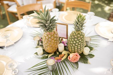 Tropical Pineapple Hawaiian Inspired Wedding Centerpiece with Gold Chargers and Palm Leaves | Wedding Reception Decor and Inspiration | St. Petersburg Wedding Florist Wonderland Floral Art | St. Pete Beach Photographer Kristin Marie Photography Pineapple Table Decor, Pineapple Wedding Decor, Wedding Beach Decor, Pineapple Decorations, Marriage Renewal, Tropical Wedding Reception, Pineapple Centerpiece, Kona Wedding, Pineapple Table